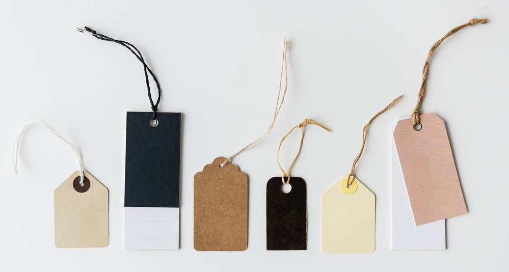 A set of neutral coloured clothes tags
