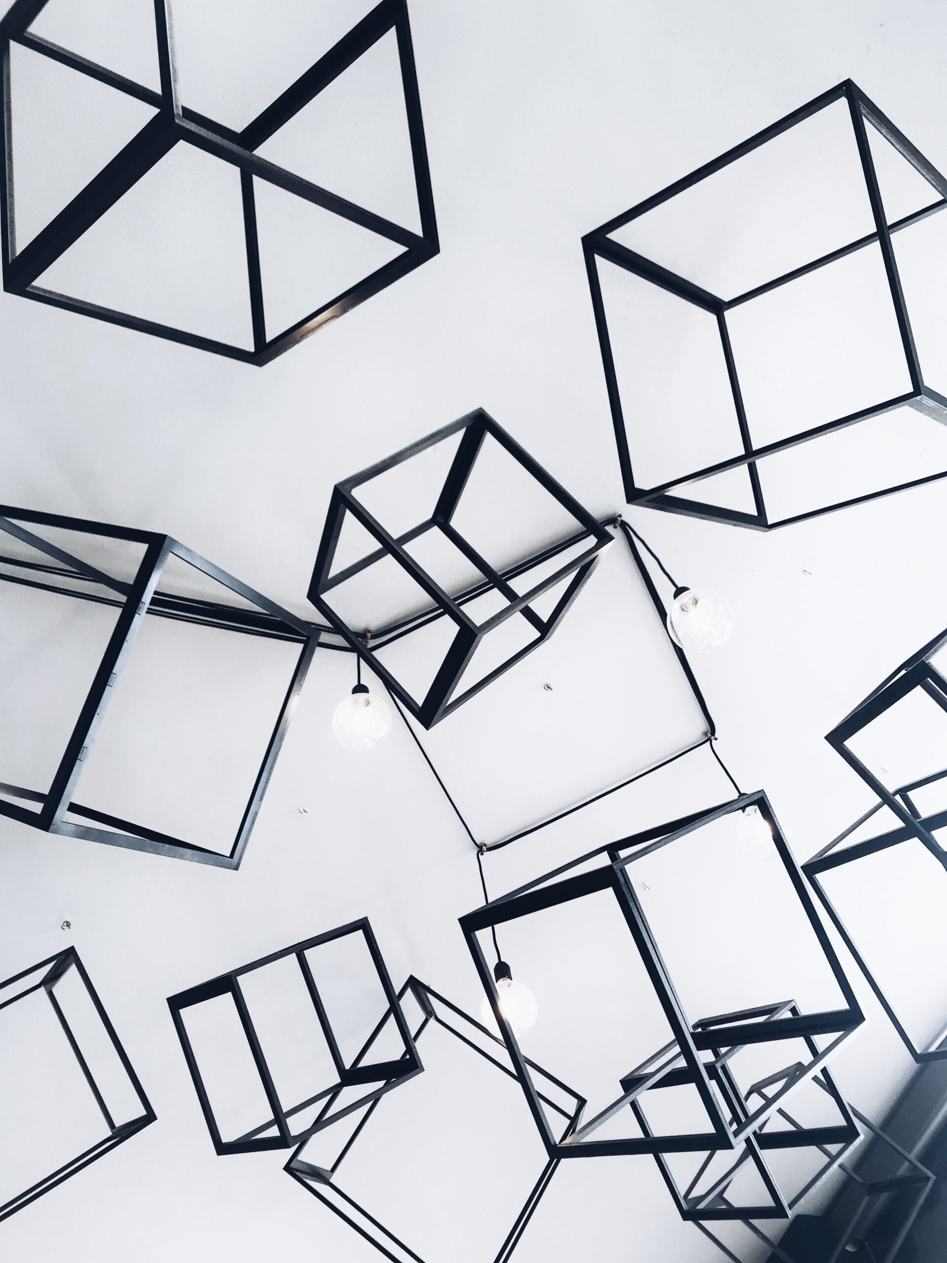 Hollow black cubes against white background